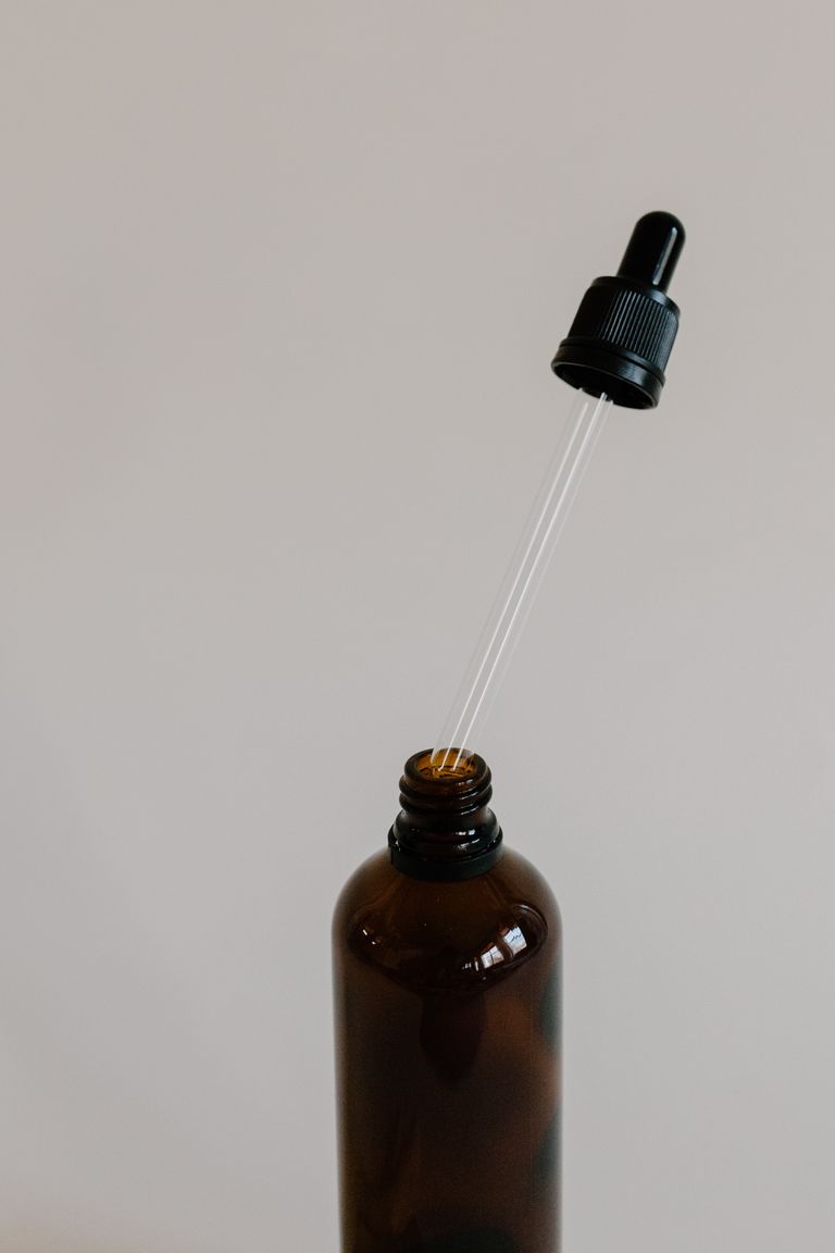 Close-up of a brown bottle with a dropper, perfect for aromatherapy and essential oils.